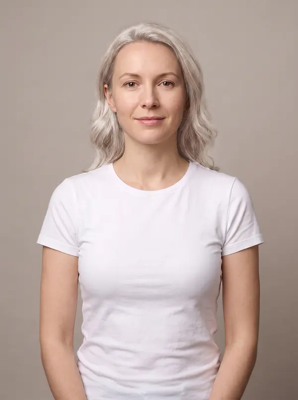 Woman with platinum blonde hair in a white t-shirt