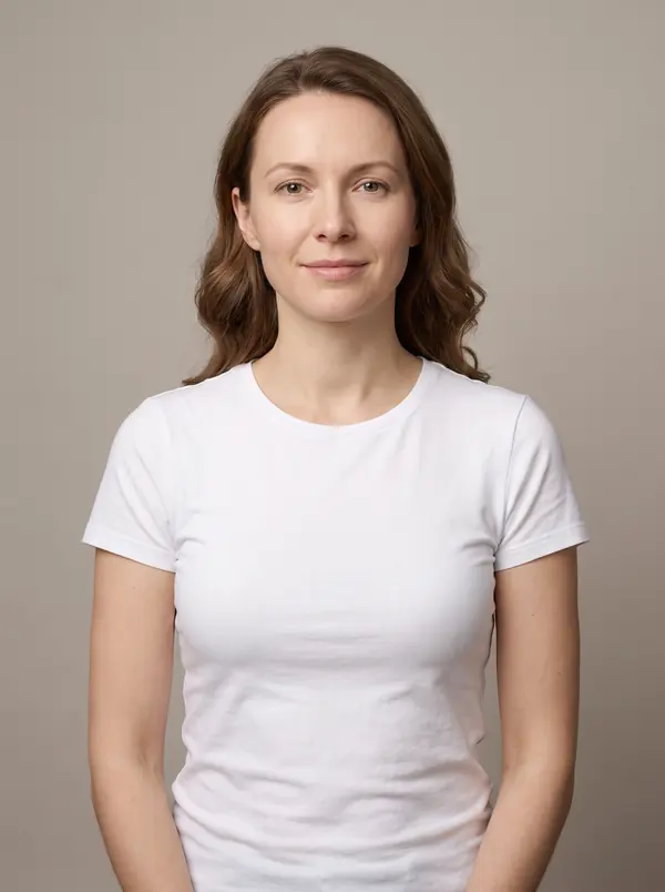 Woman with natural medium brown wavy hair in a white t-shirt
